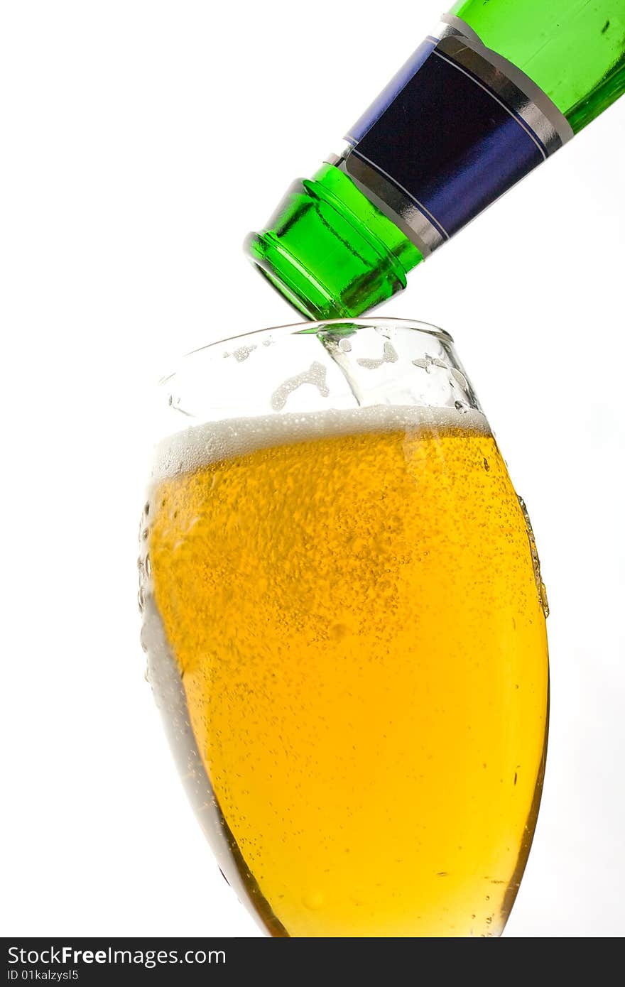 Image of a bottle of beer being poured into a glass. Image of a bottle of beer being poured into a glass