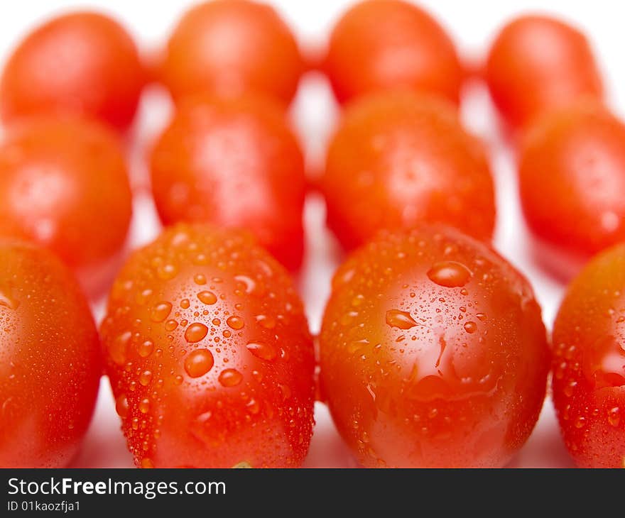 Red tomatoes close-up with drops. Red tomatoes close-up with drops.