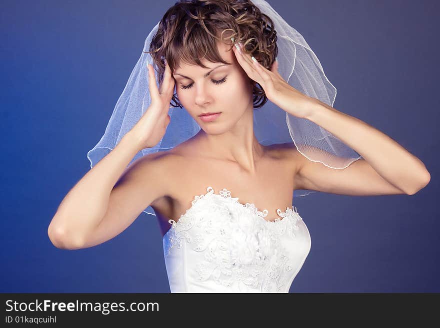 Studio Portrait Of The Young Coquettish Bride