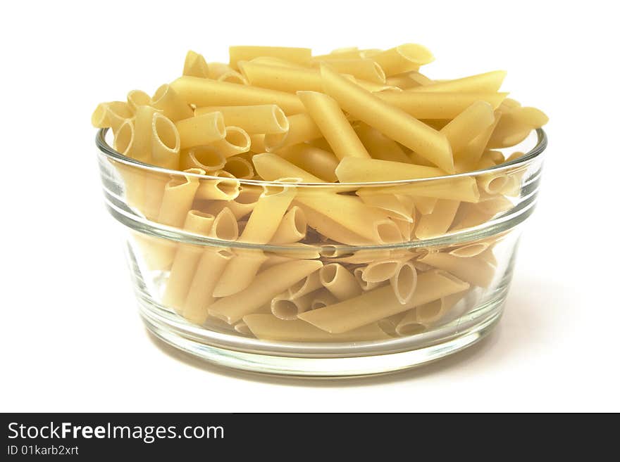 Macaroni penne in glass container isolated on white. Macaroni penne in glass container isolated on white