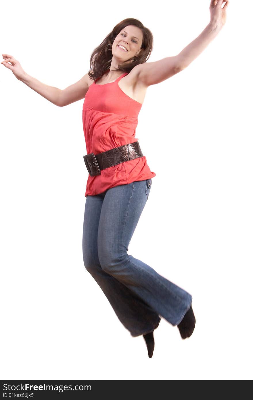 Young woman jumping in the air. Slight motion bluriness is intended. Young woman jumping in the air. Slight motion bluriness is intended.