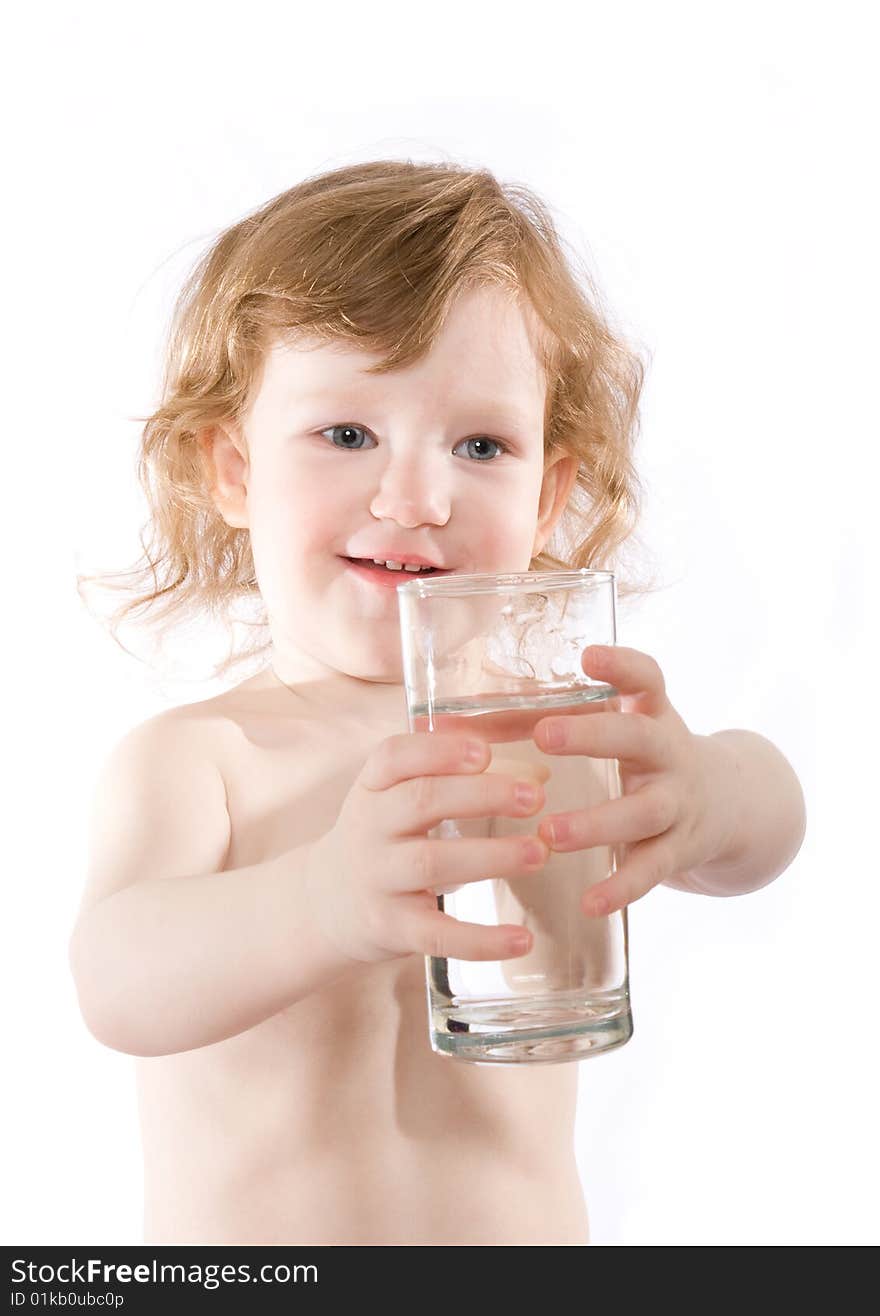 Cute little girl with a glass of clear water