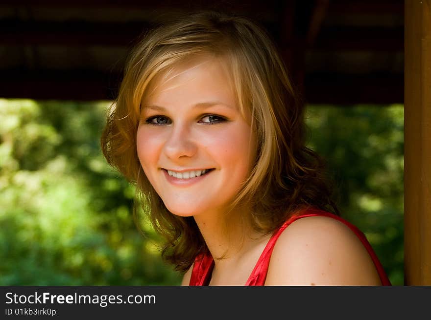 Closeup portrait of a beautiful smiling young woman