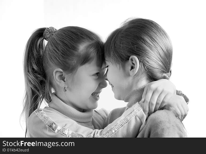 An image of two little girls looking at each other. An image of two little girls looking at each other