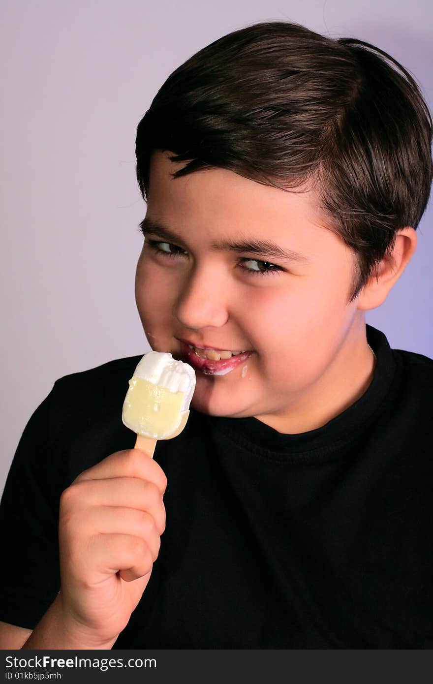 Little boy eats tasty ice-cream