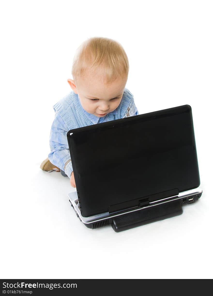 Concept of little businessman. Little child and laptop. Isolated on white background