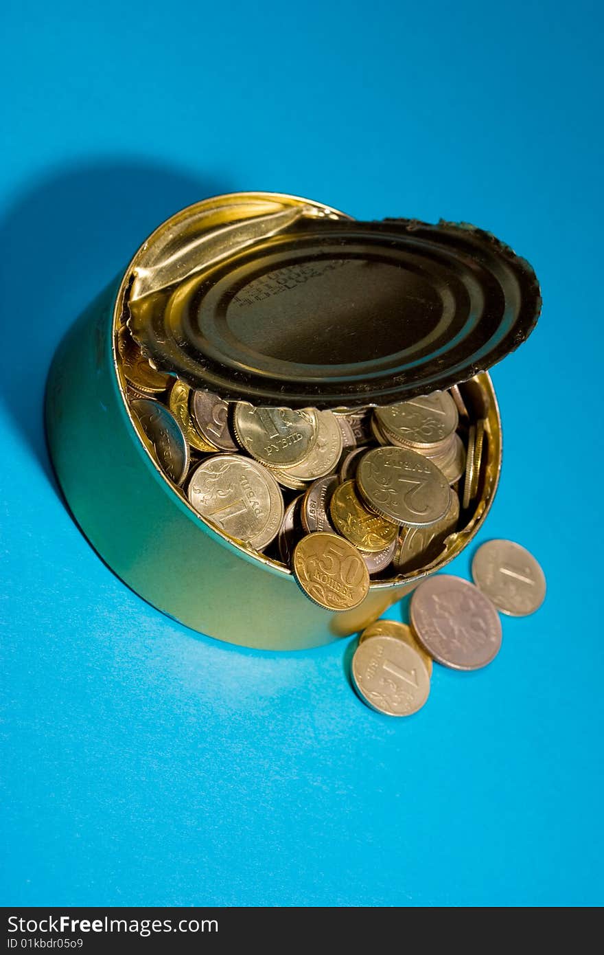 Tin with coins