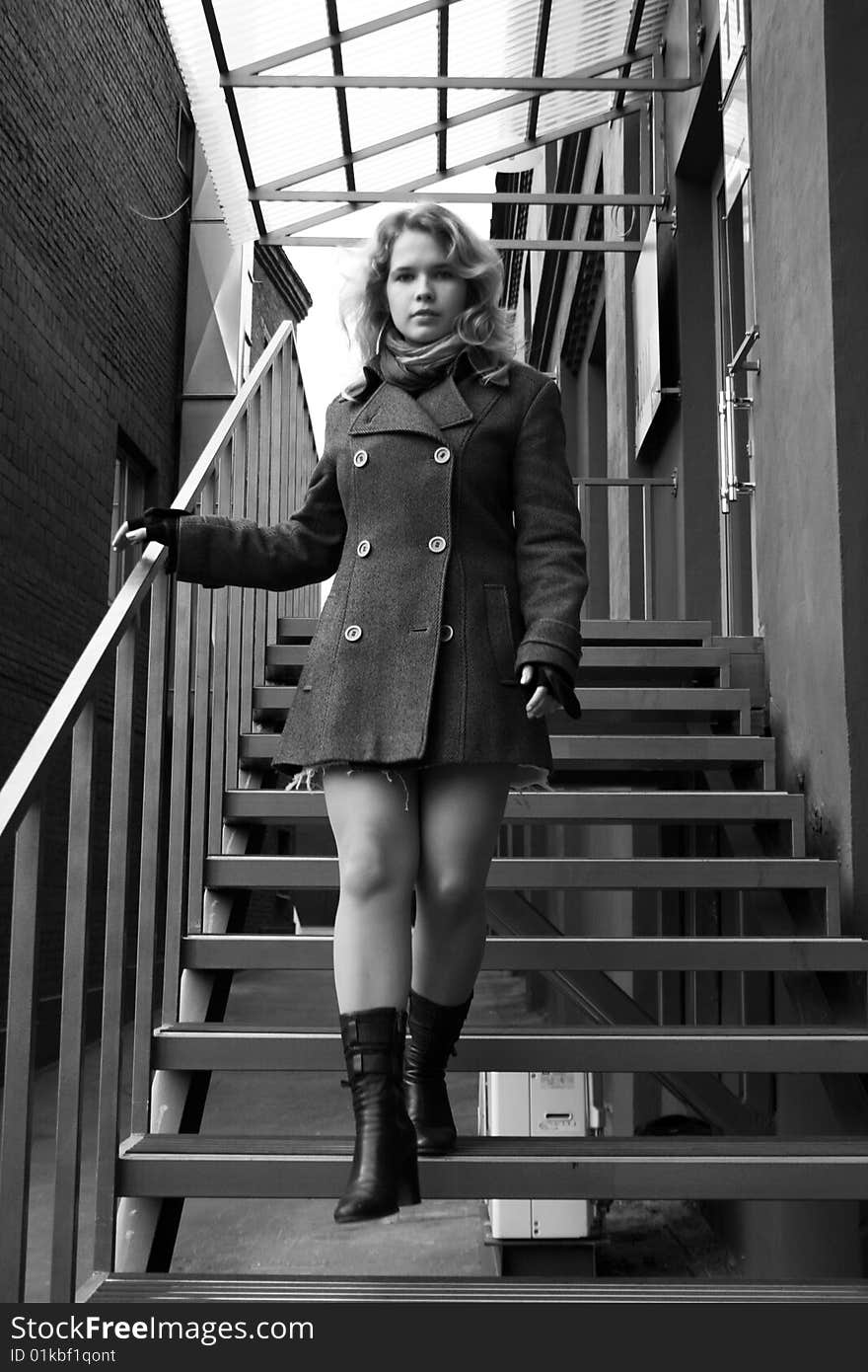Girl walking down the stairs outdoor. Girl walking down the stairs outdoor