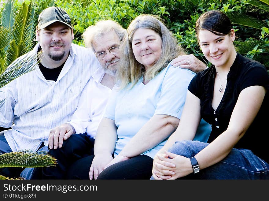 A happy family of four at the park