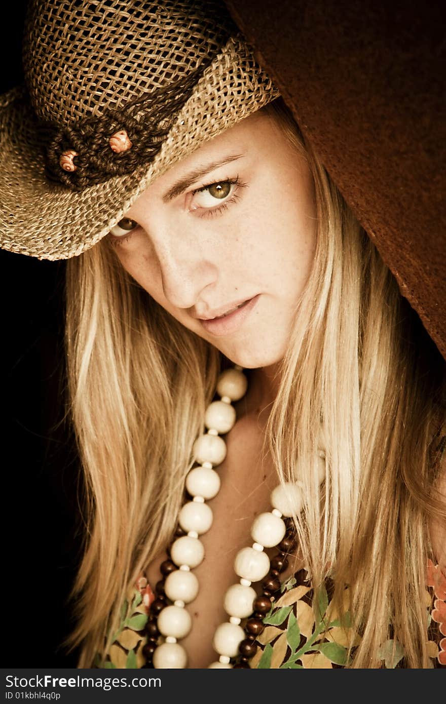 Young blond woman with hat.