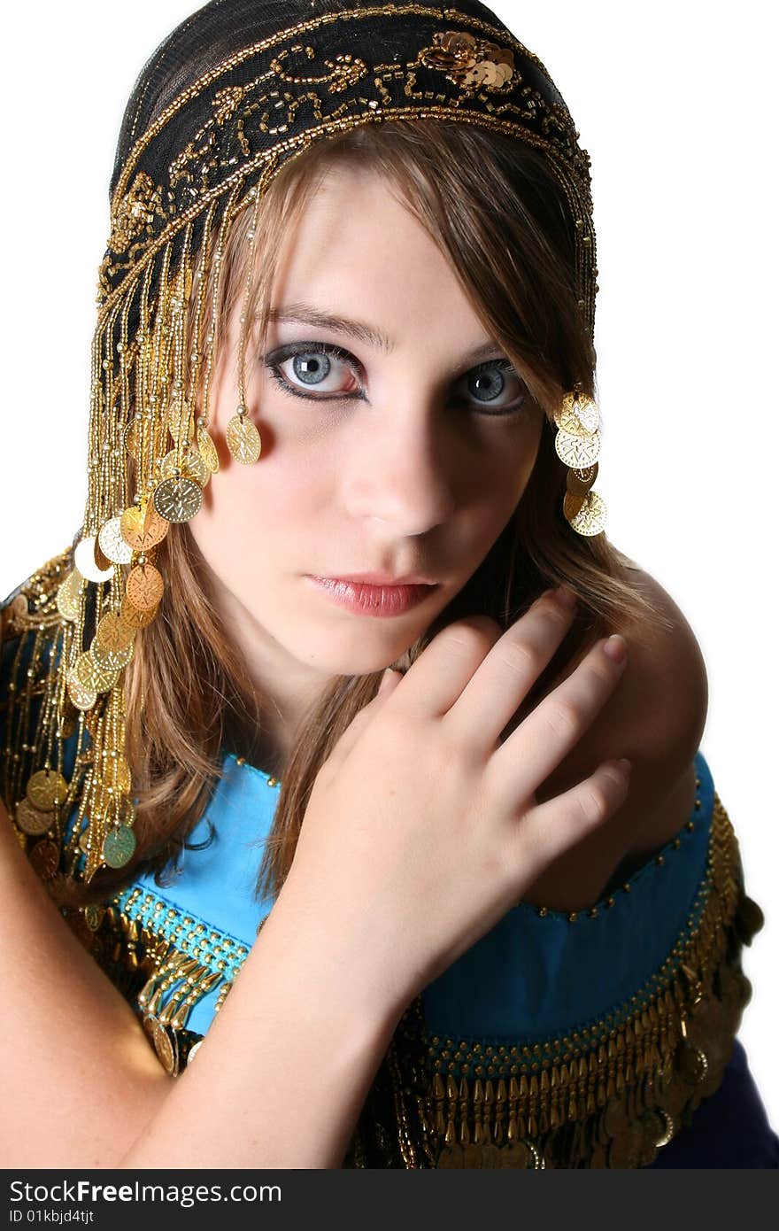 Beautiful young teenager posing in a belly dance costume. Beautiful young teenager posing in a belly dance costume