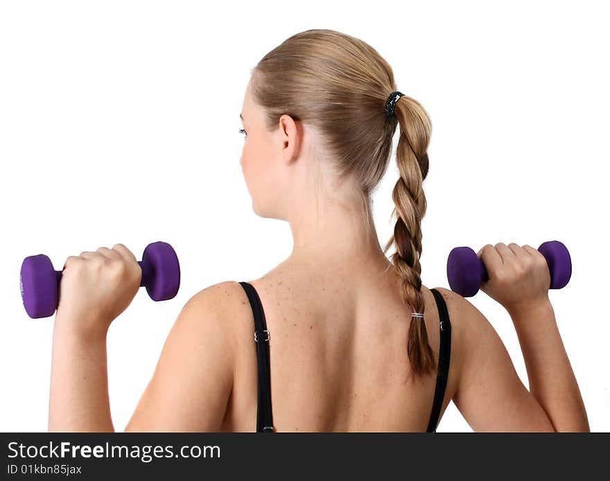 Young blonde exercising with light purple weights. Young blonde exercising with light purple weights