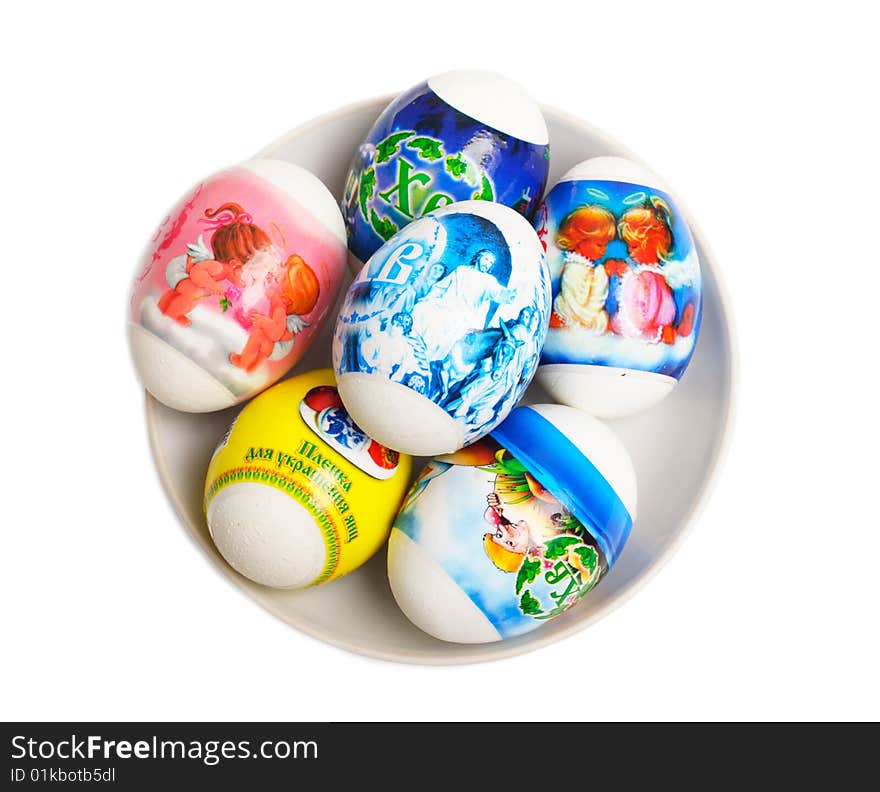 Easter eggs on a plate are isolated on a white background