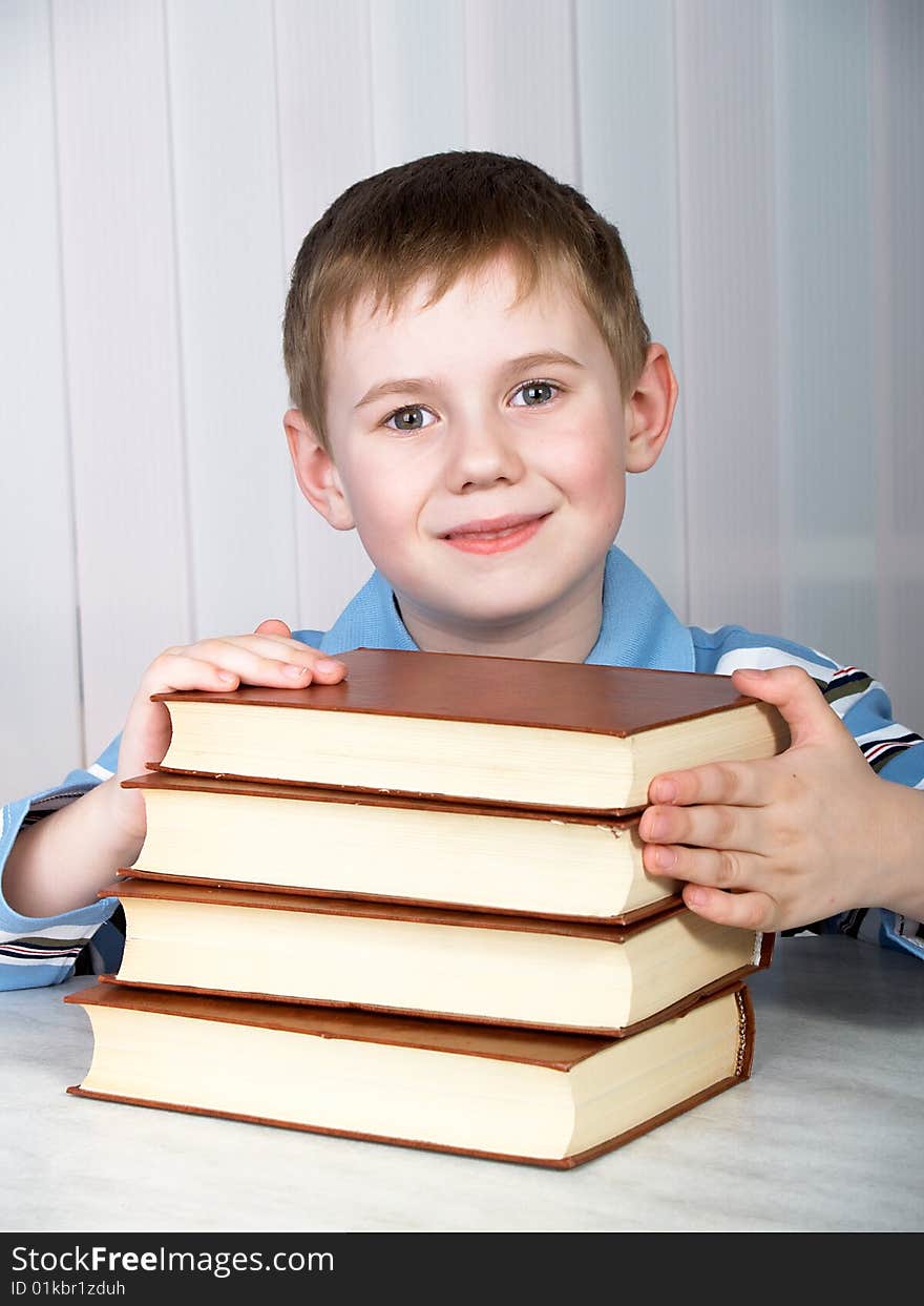 The child with books on the white