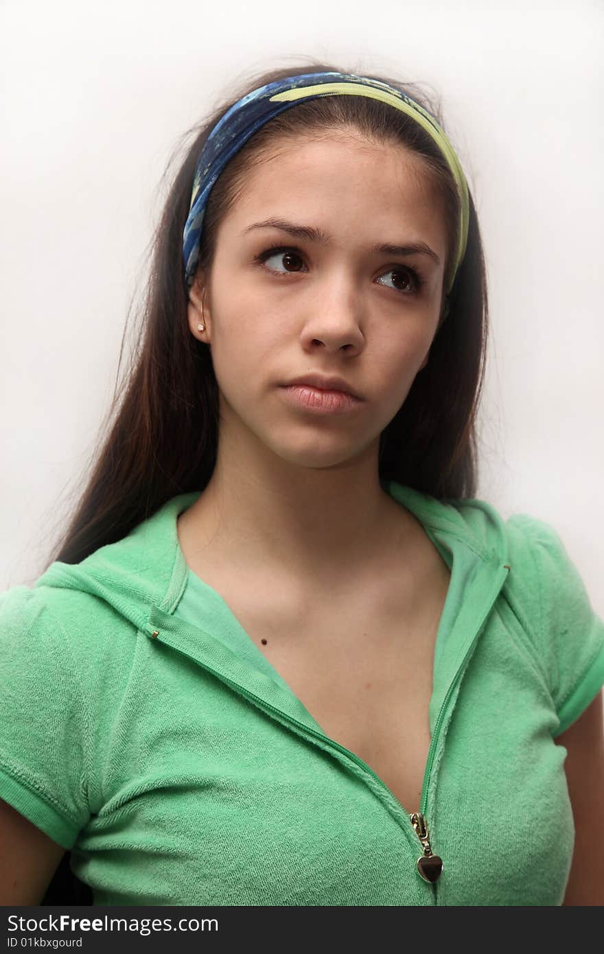 Girl with long hairs,   to the green blouse and by a scarf on a head