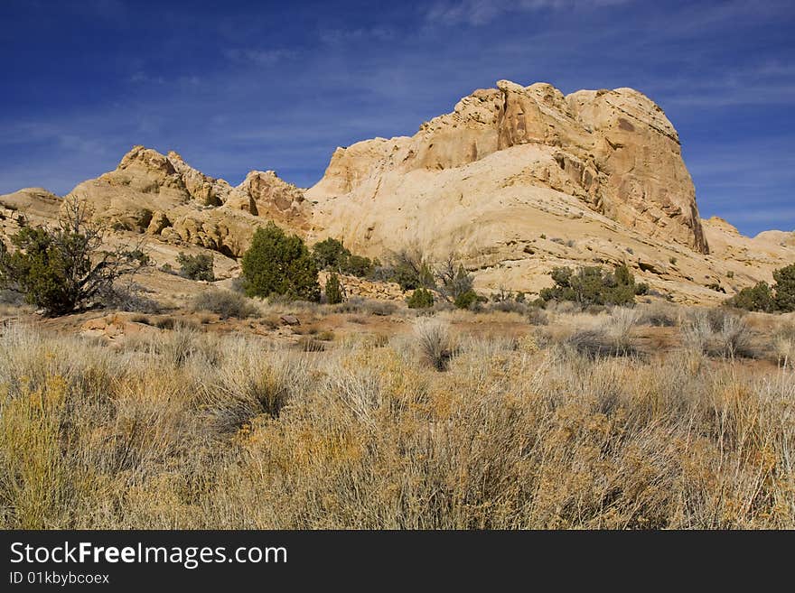 View of red rock formations in San Rafael Swell with blue sky�s the and clouds