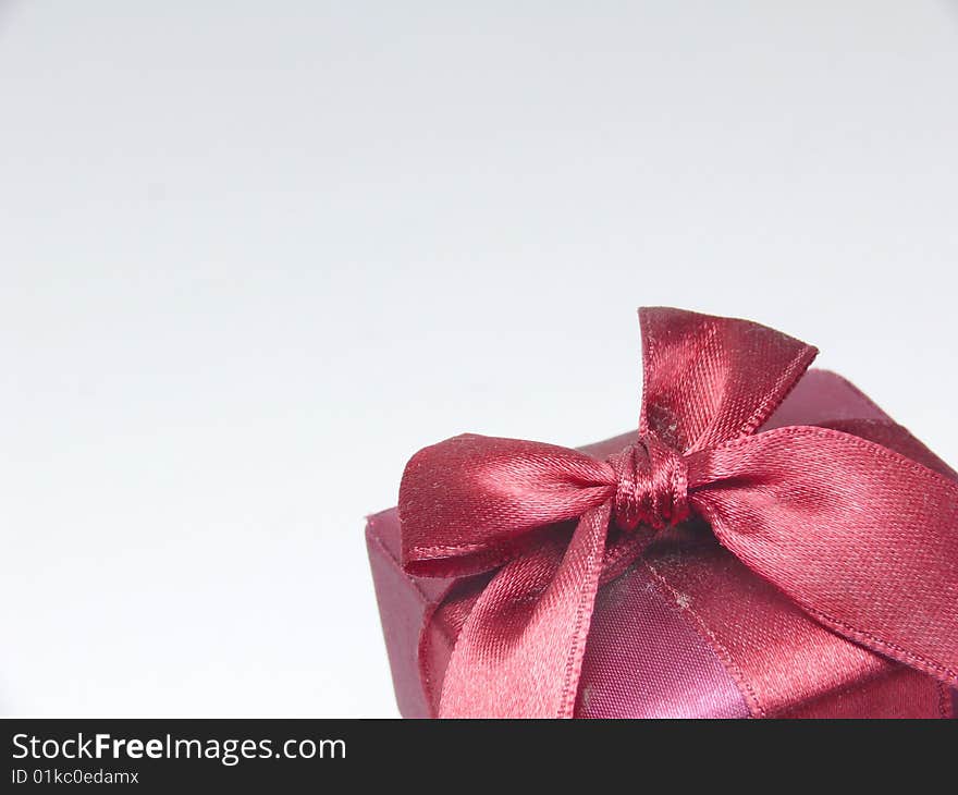 Red gift box with red ribbon