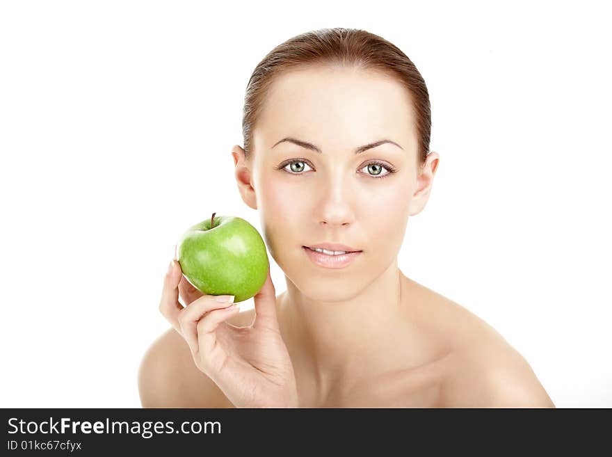 The Portrait of the woman pressing an apple to a cheek, isolated. The Portrait of the woman pressing an apple to a cheek, isolated