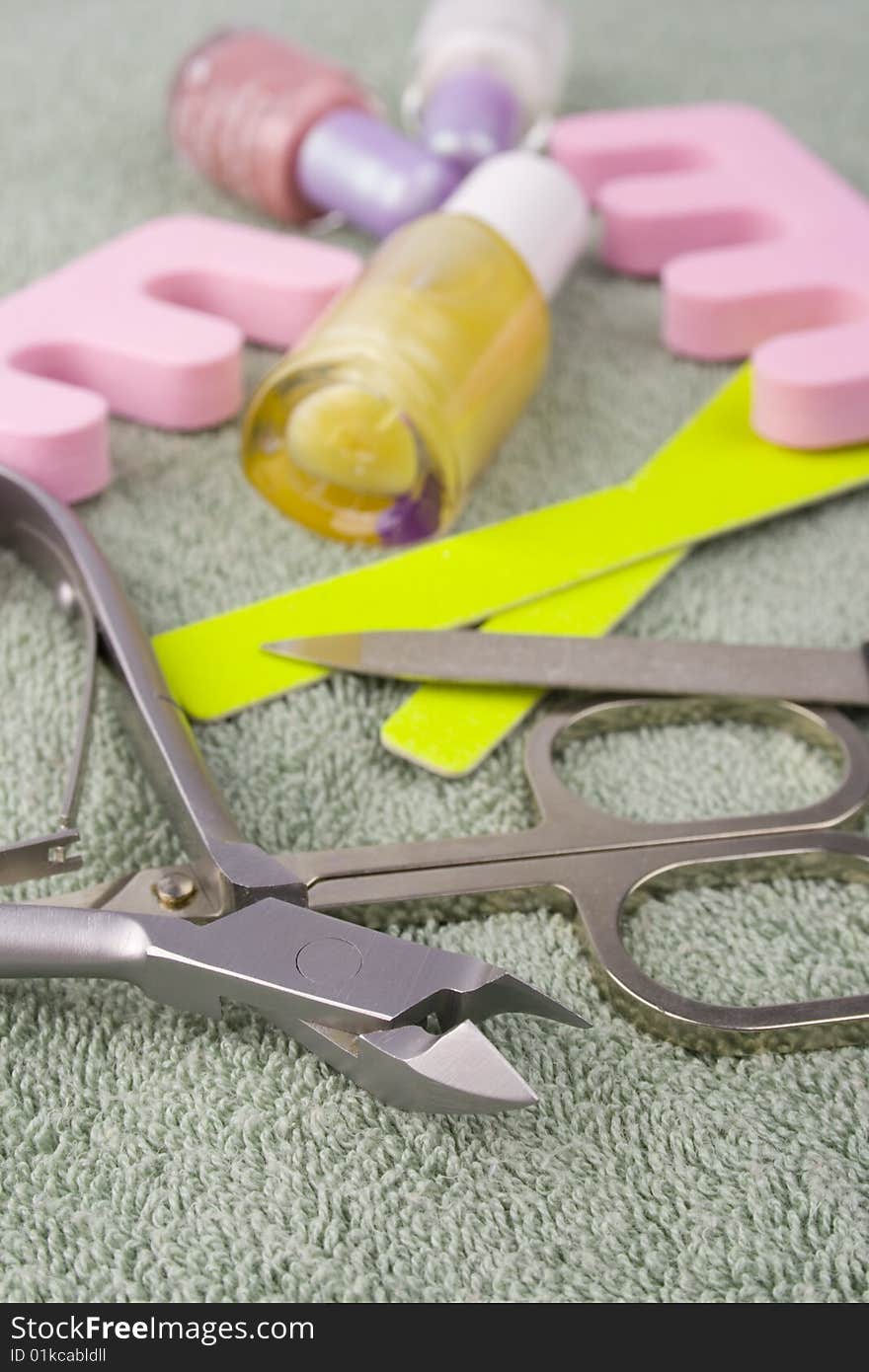 Pedicure beauty set on towel background