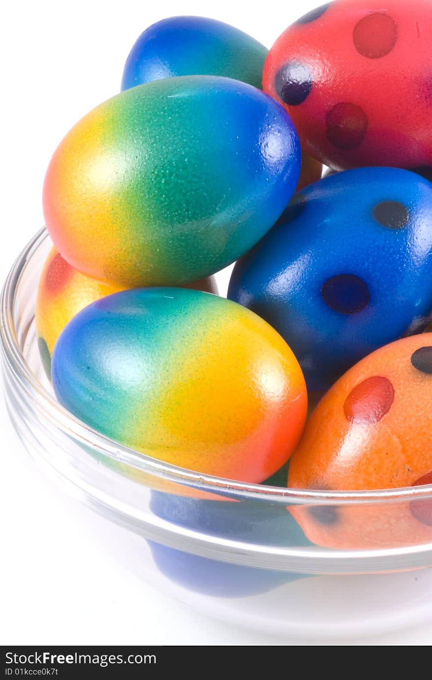 Easter eggs in bowl of glass, isolated on white. Easter eggs in bowl of glass, isolated on white.