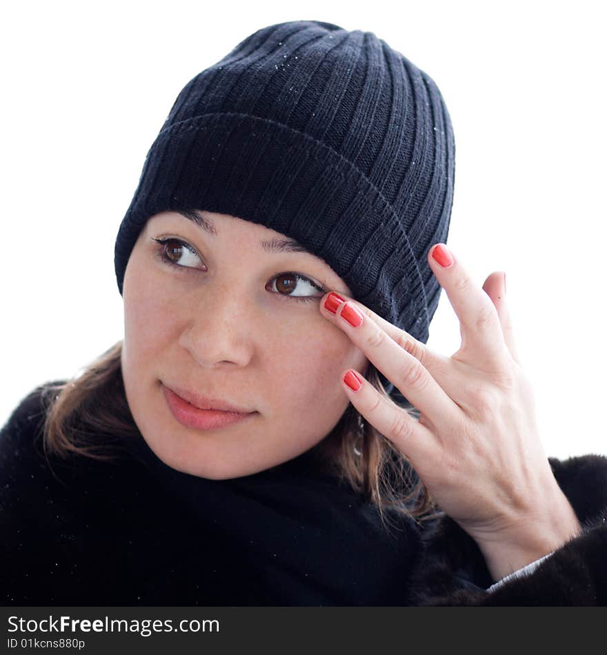 Pretty lady removing something out of her eye - portrait isolated on white