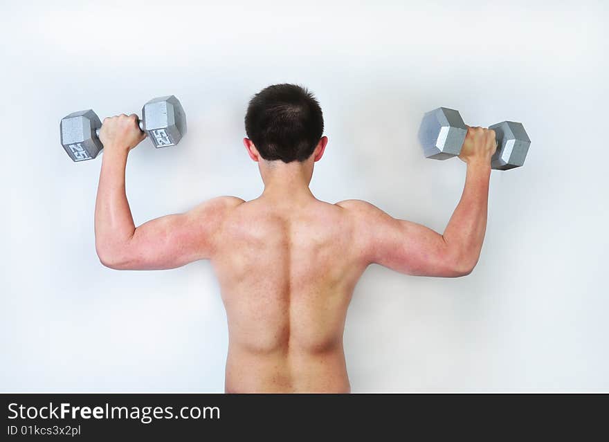 Young male lifting weights on white background.