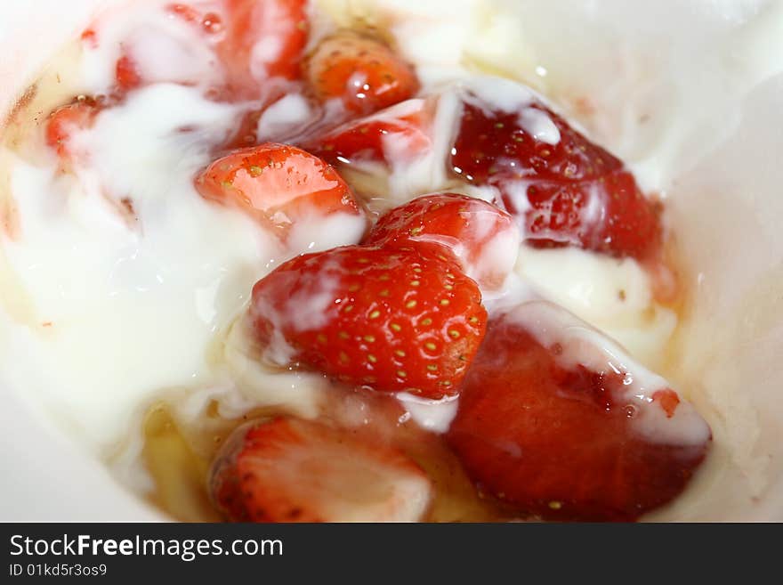 Strawberries on yogurt taken close up shot. Strawberries on yogurt taken close up shot.