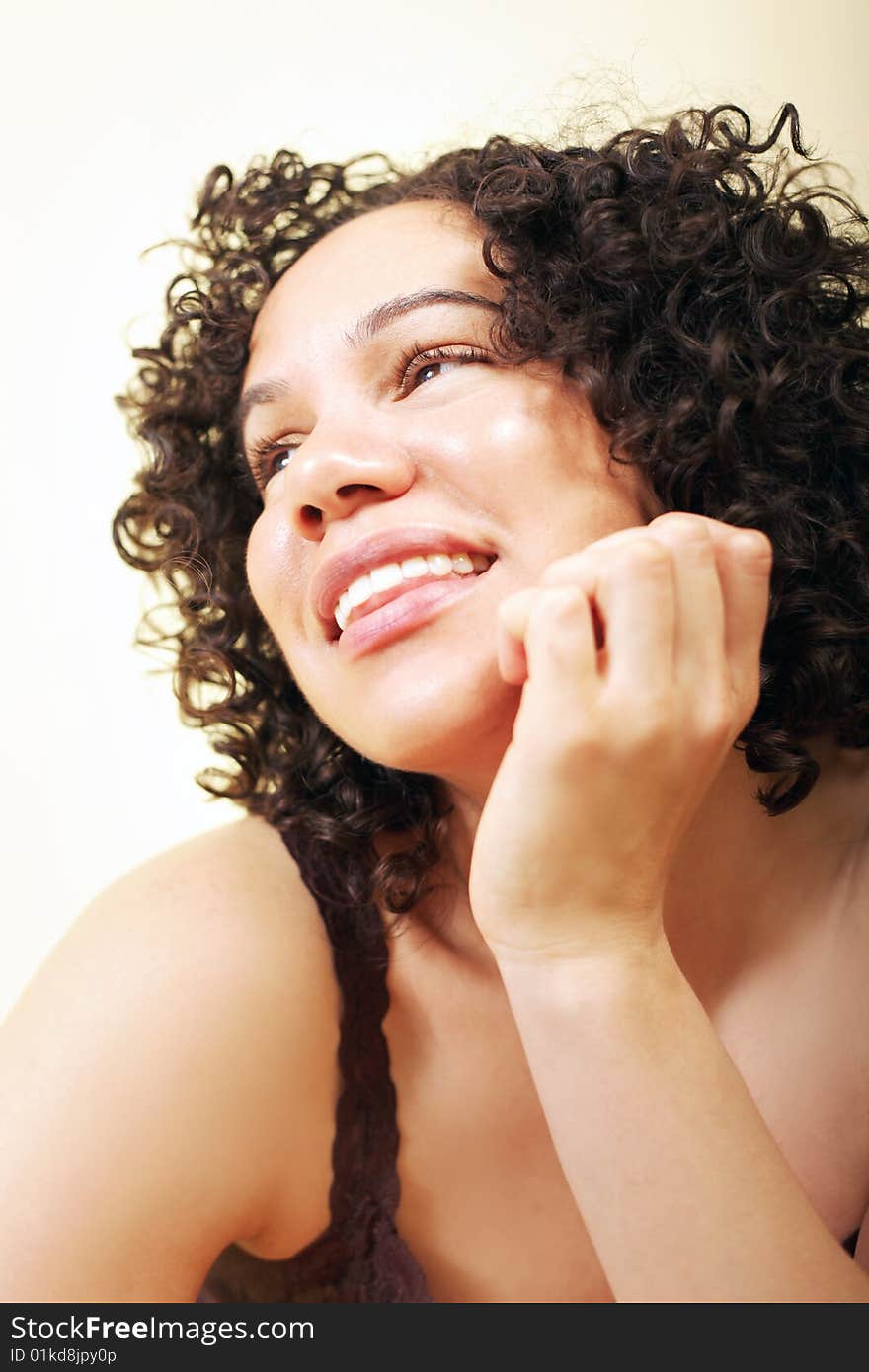 Cute young woman pondering something while looking away from the camera. Cute young woman pondering something while looking away from the camera