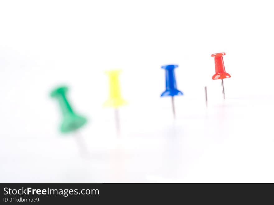 Colorful office pin with red standing out. Colorful office pin with red standing out