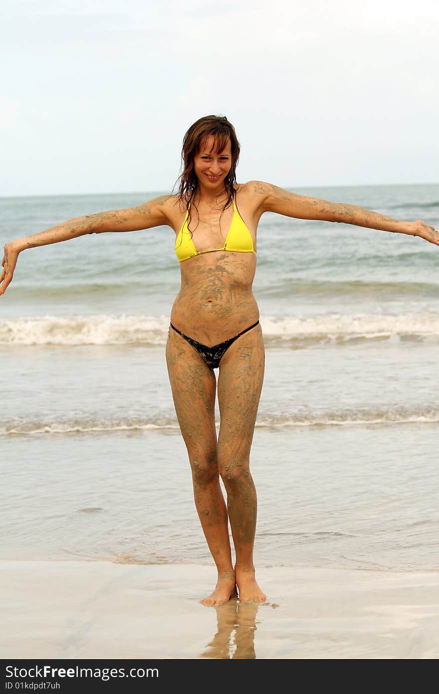 Woman on the beach smiling