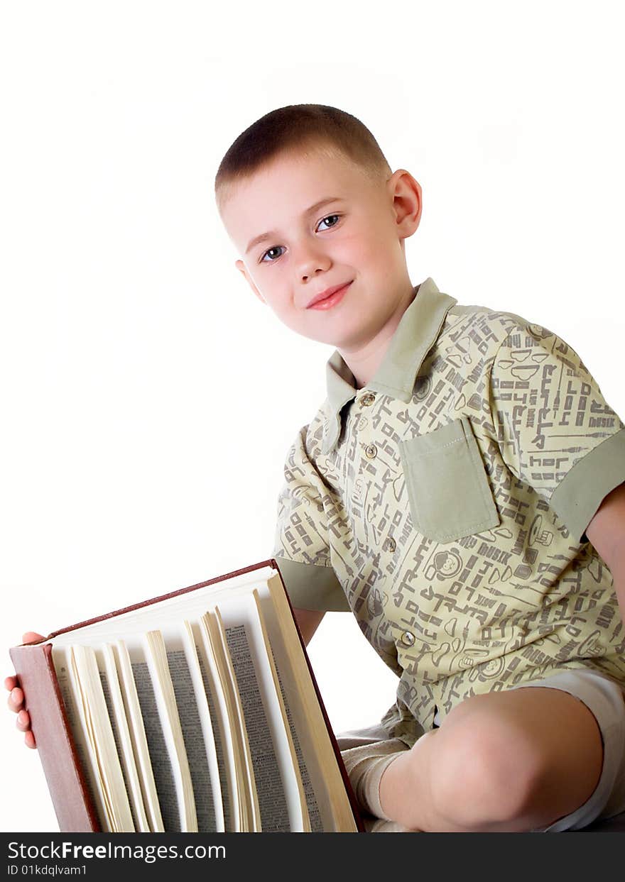 The child with book on the white