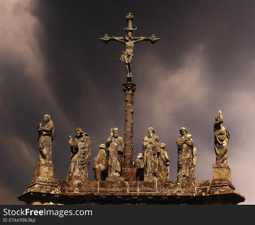 Statues of saints on a background a storm sky