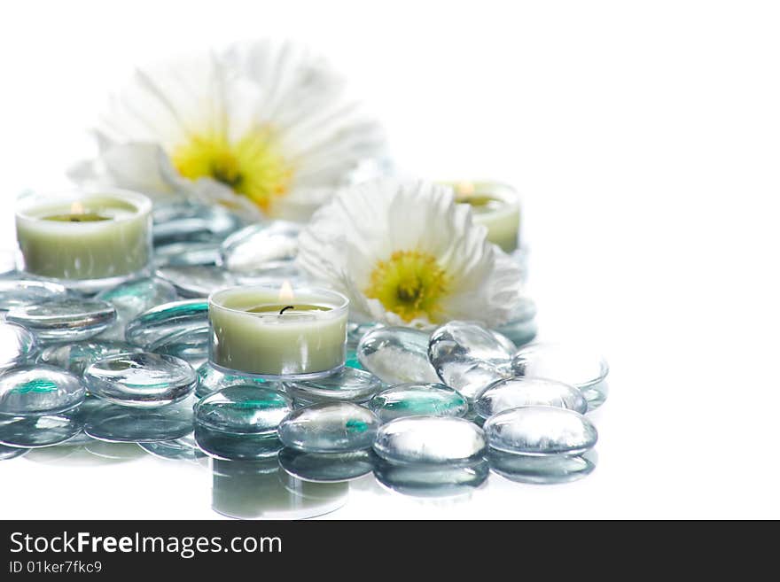 Day Spa with flowers candles in a zen setting isolated on white