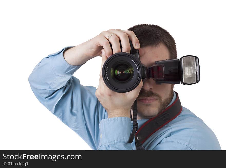 Young, handsome man, holding a camera in portrait shooting position, ready to take some shots. Young, handsome man, holding a camera in portrait shooting position, ready to take some shots