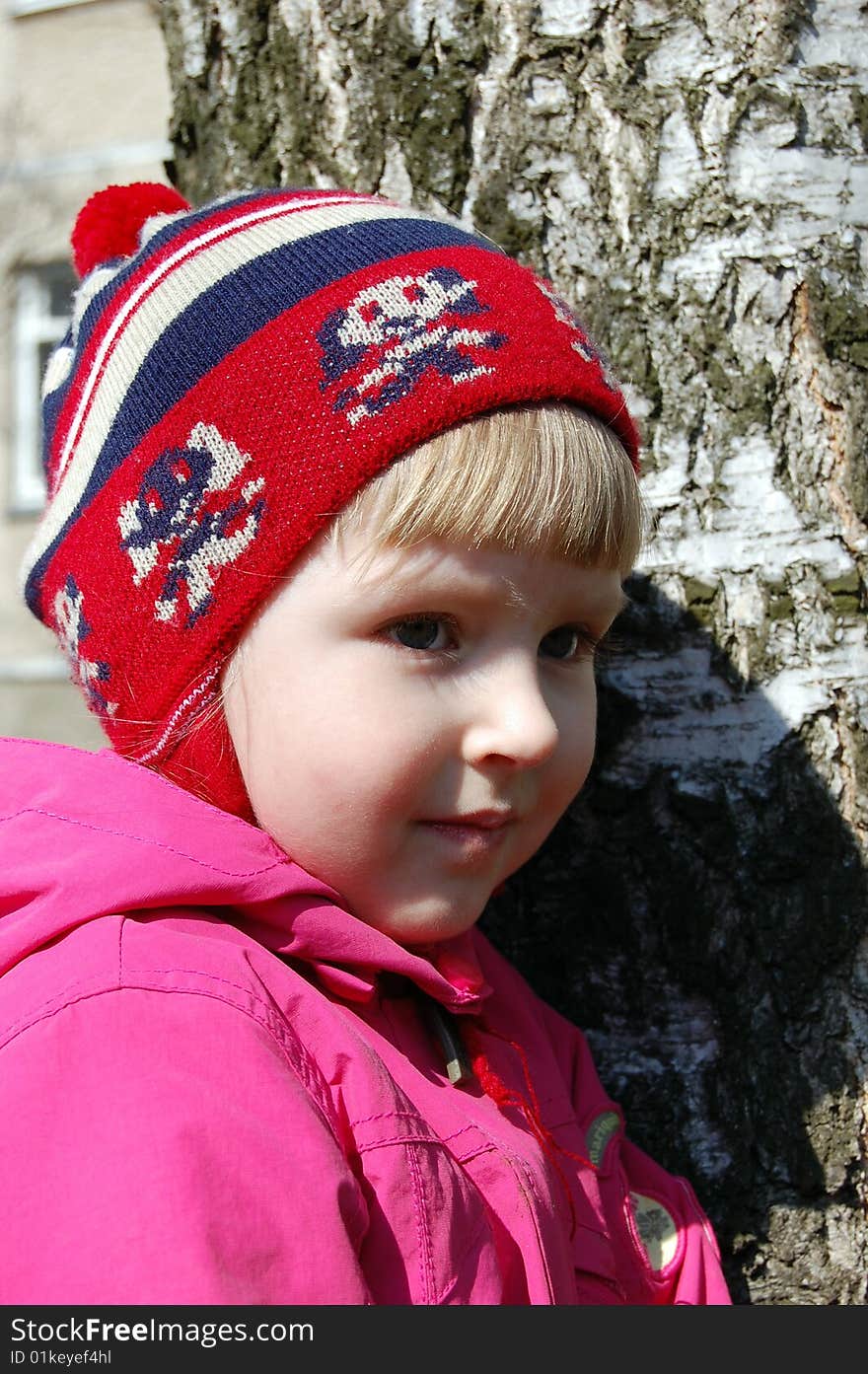 Little girl rest a birch