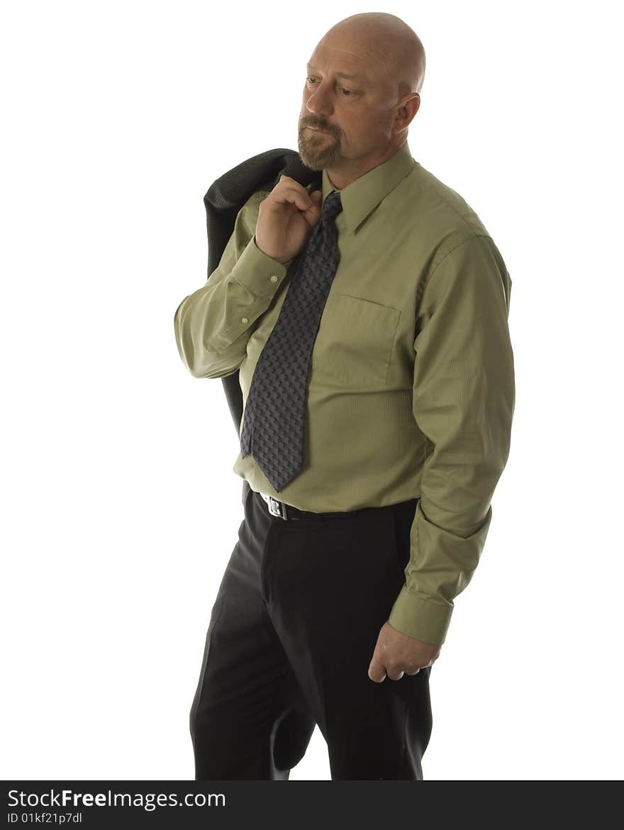 businessman Bald man in dress attire with coat over shoulder looking down on an isolated white background in his 40's .  businessman Bald man in dress attire with coat over shoulder looking down on an isolated white background in his 40's