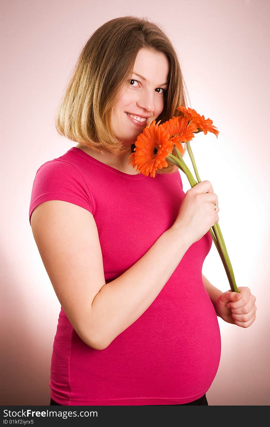 Portrait of joyful young beautiful pregnant woman