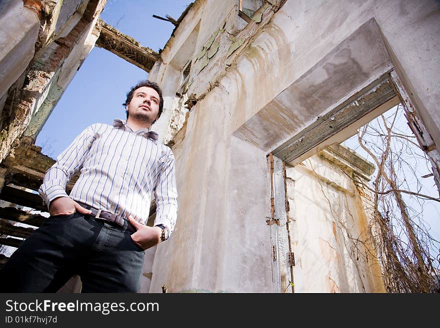 Young man in abandoned building