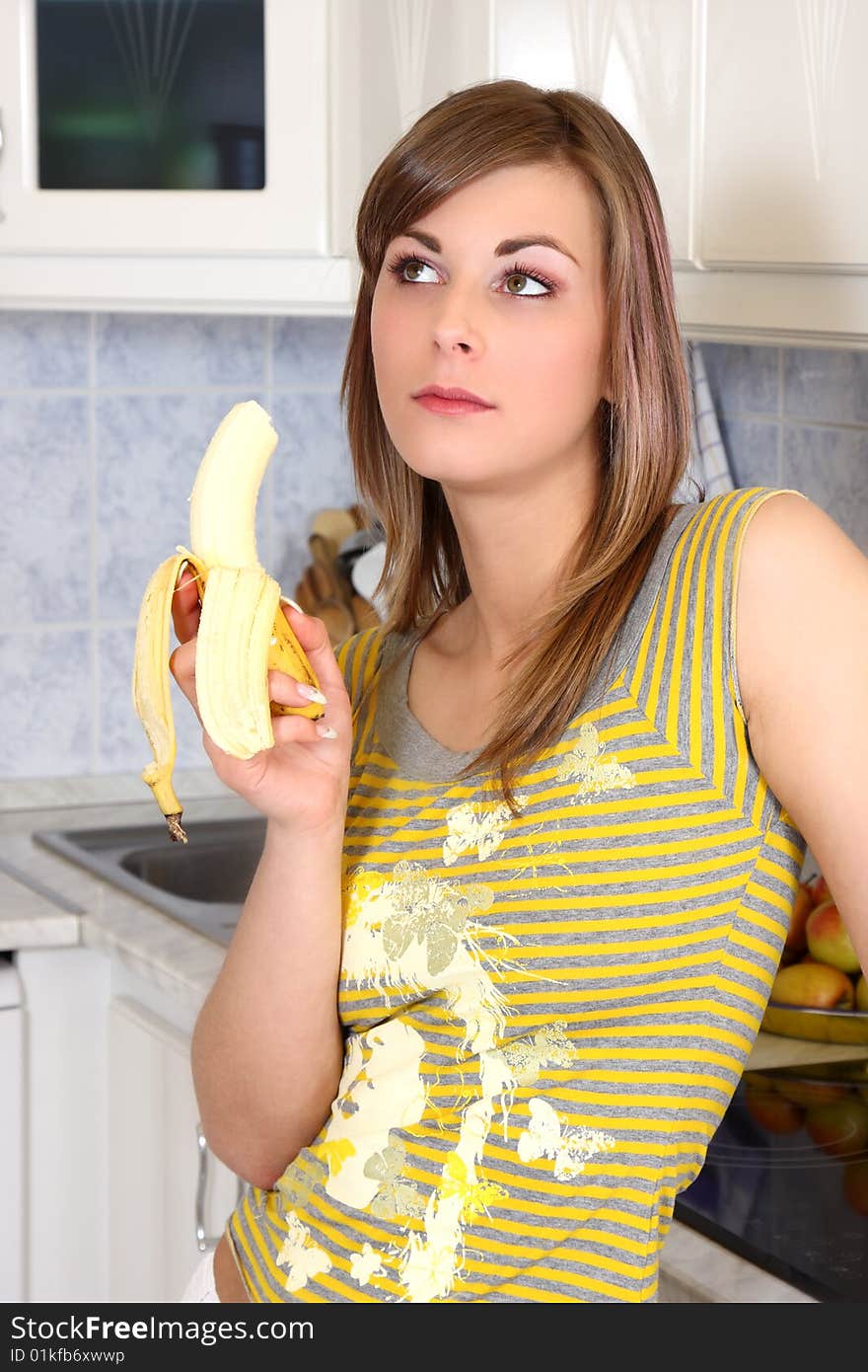 Young Woman In Her Kitchen