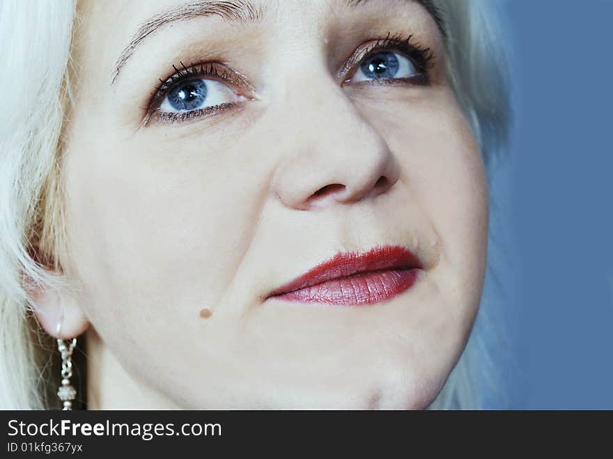 Closeup of face of white woman with blue eyes. Closeup of face of white woman with blue eyes