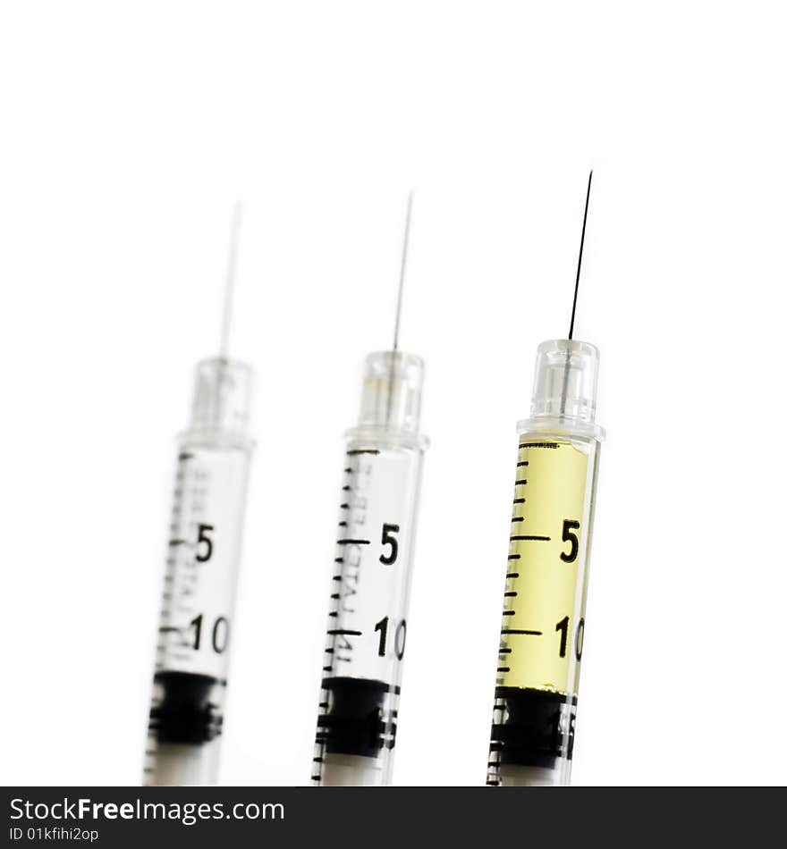 Three syringes isolated on white background