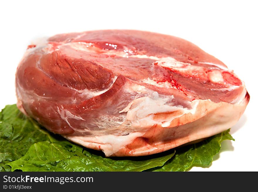 Red Meat on a white background with lettuce