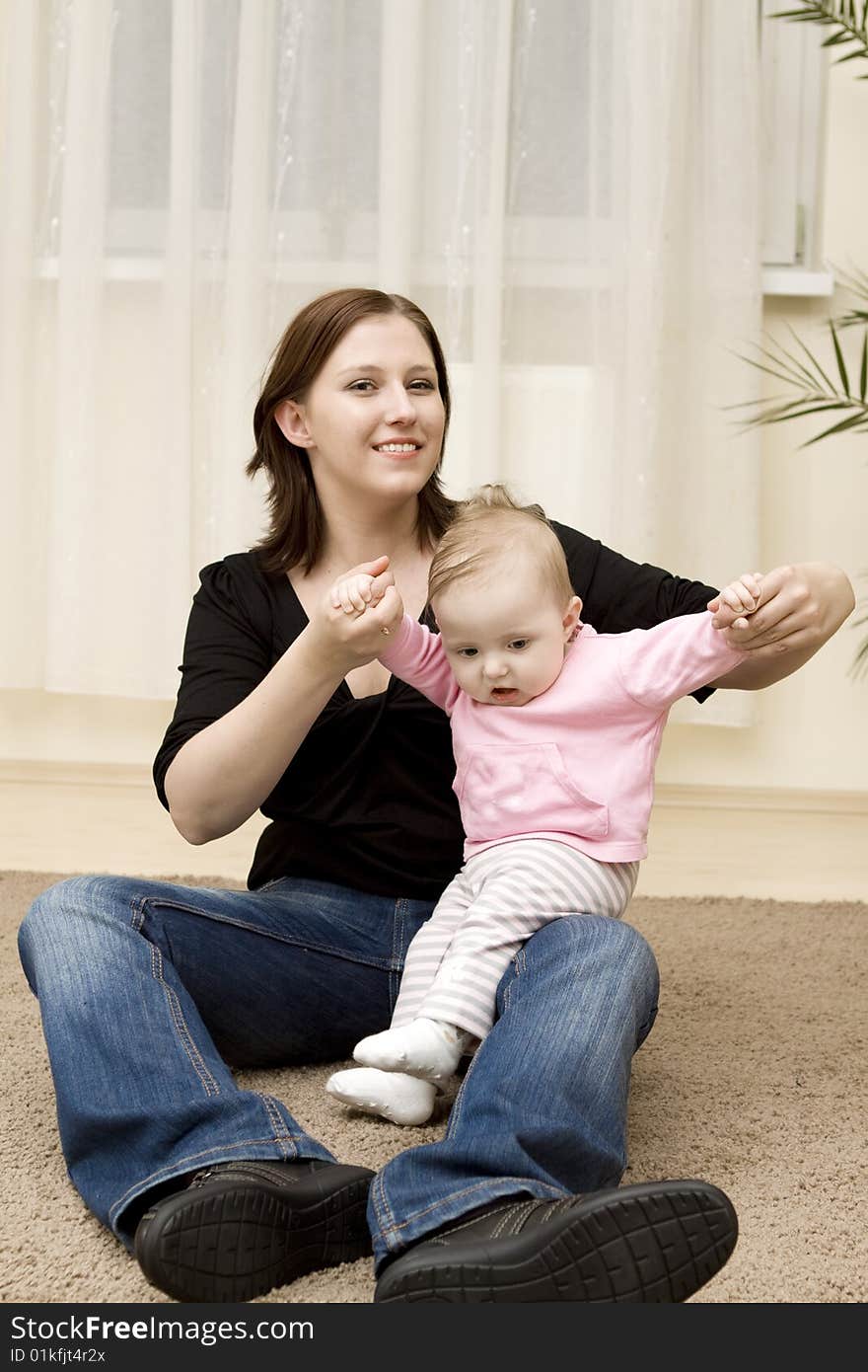 Mother and baby playing at home