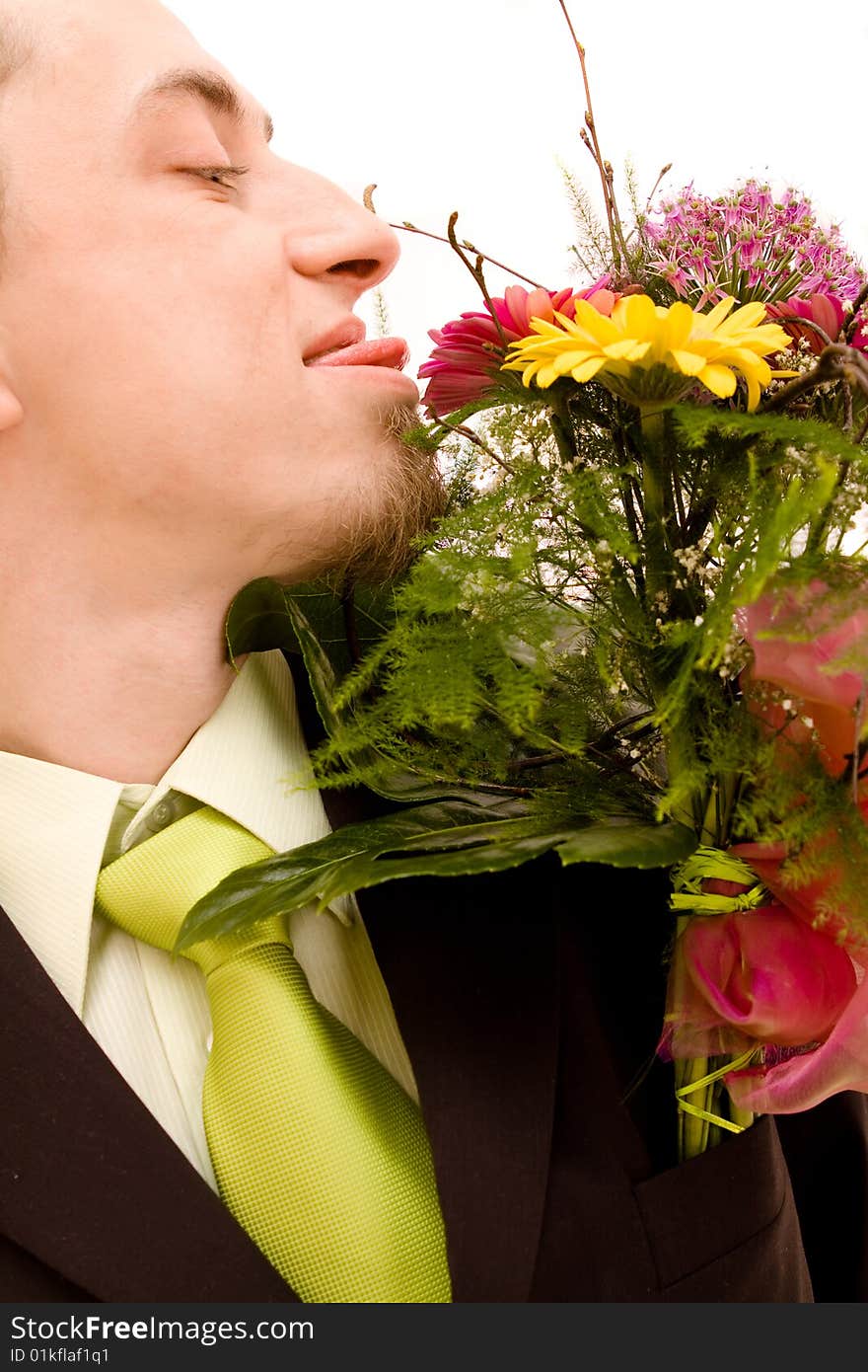 Man with flowers on white background