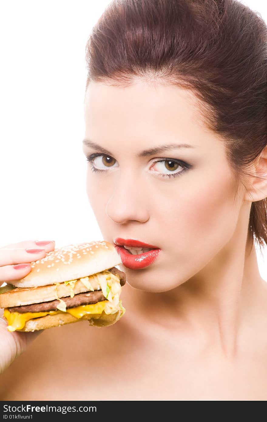 Close-up portrait of young woman with hamburger. Close-up portrait of young woman with hamburger