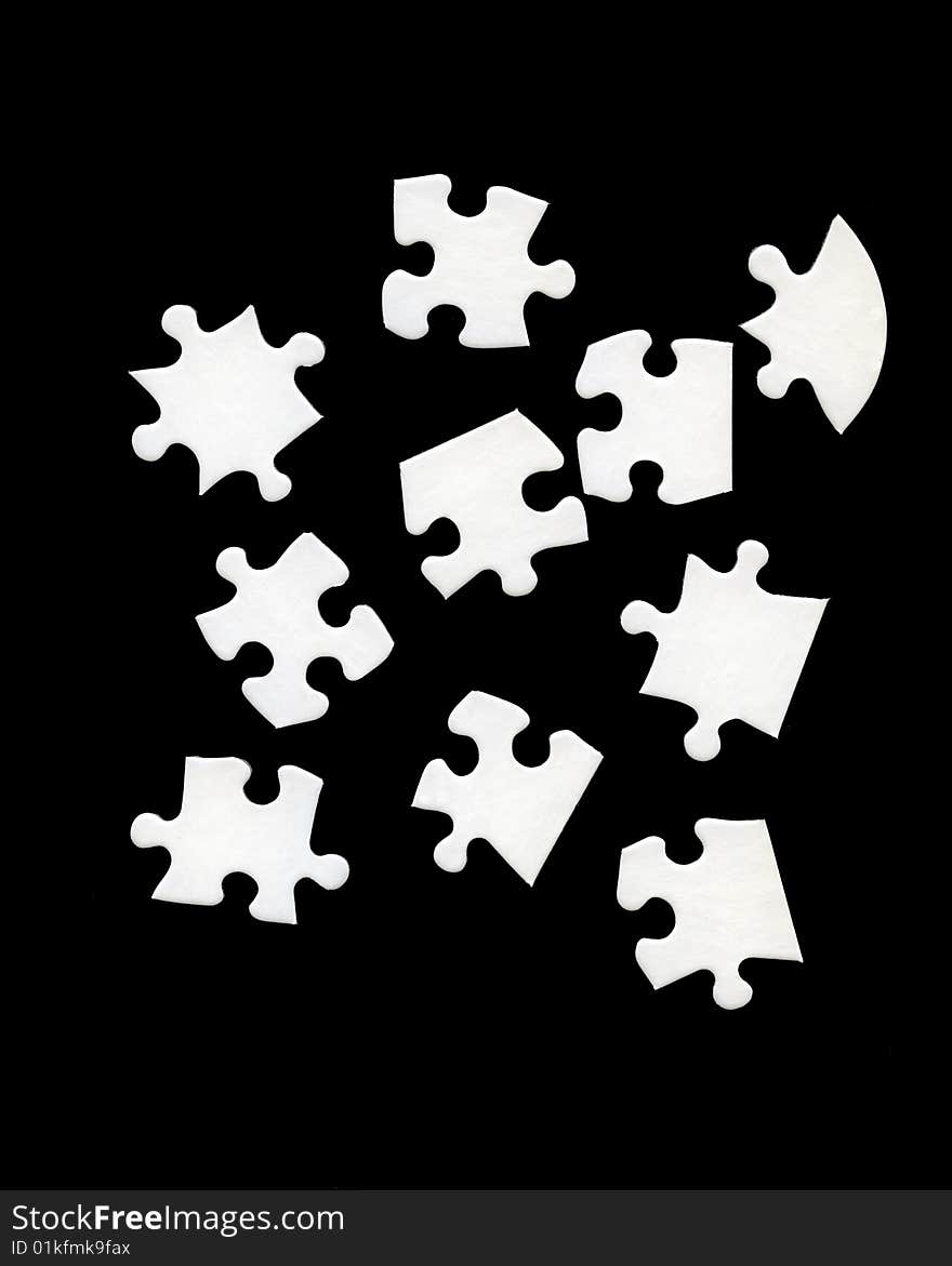 White jigsaw pieces on black background. White jigsaw pieces on black background.