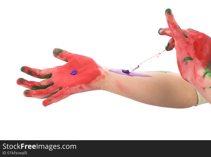 Girl paints the hands. Isolated on white background