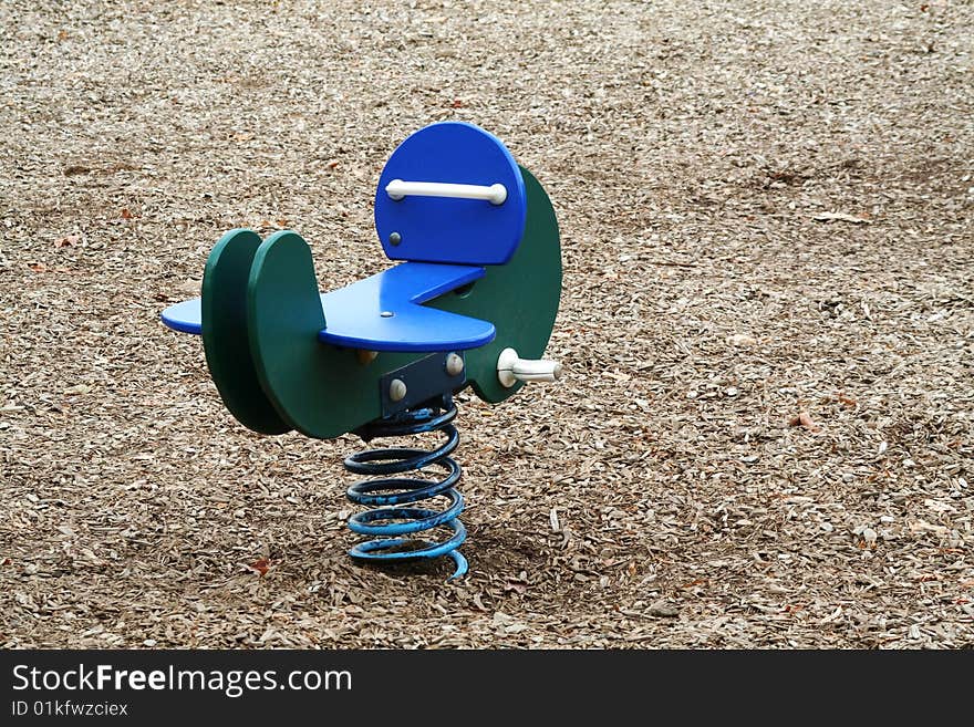 A spring toy airplane in a park. A spring toy airplane in a park