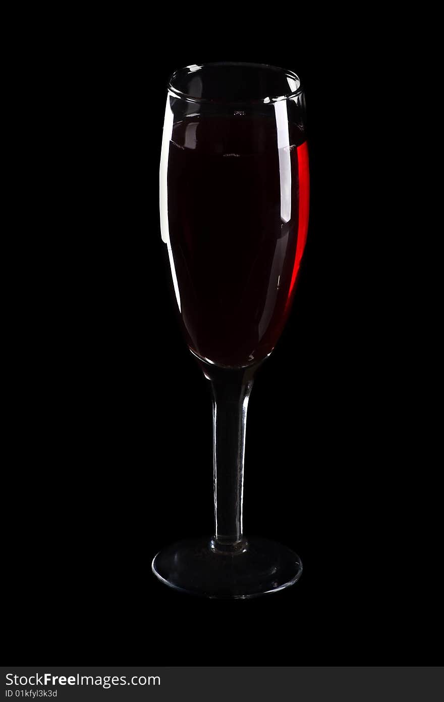 Wine glass isolated at black background