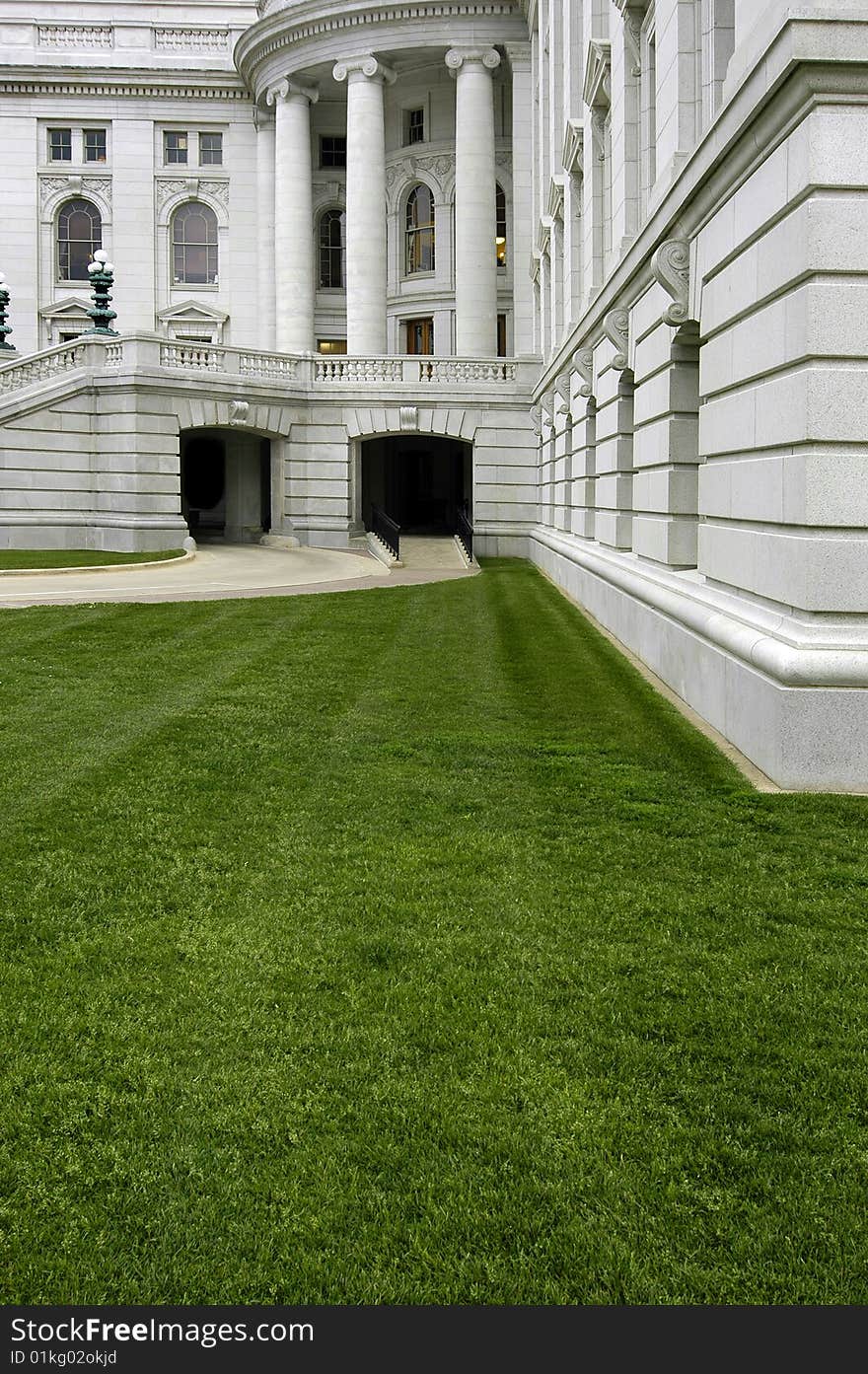 Columns of an old building, architecture and grass lawn. Columns of an old building, architecture and grass lawn